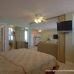 There is a sliding partion (behind the TV) that can be closed for bedroom privacy There is a sliding partion (behind the TV) that can be closed for bedroom privacy