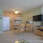 Great view of the kitchen and HD TV from the couch and a ceiling fan in the kitchen Great view of the kitchen and HD TV from the couch and a ceiling fan in the kitchen